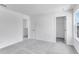 A bright bedroom has a walk-in closet and a window that lets in natural light at 205 Groveton Ct, Euharlee, GA 30145