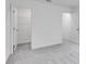 Bedroom boasts neutral walls and soft carpeting; access to walk-in closet and additional room at 205 Groveton Ct, Euharlee, GA 30145