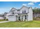 Exterior view of new construction two-story home with lawn at 205 Groveton Ct, Euharlee, GA 30145