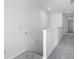 Upstairs hallway featuring soft carpeting with white walls and railing at 205 Groveton Ct, Euharlee, GA 30145