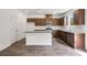 Well-lit kitchen features stainless appliances, granite counters, a white subway tile backsplash, and a center island at 205 Groveton Ct, Euharlee, GA 30145