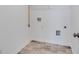 Utility room includes tile flooring with various hookups and fixtures for modern appliances at 205 Groveton Ct, Euharlee, GA 30145