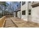 Backyard with a wooden deck, gray siding, and view to the woods at 2410 Glade Overlook, Cumming, GA 30041