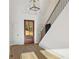 Bright foyer features hardwood floors, stairway, and a stylish light fixture at 2410 Glade Overlook, Cumming, GA 30041