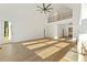 Bright living room featuring hardwood floors, vaulted ceilings and a second story overlook at 2410 Glade Overlook, Cumming, GA 30041