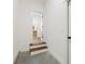 Mud room features wood stairs and white trim at 2410 Glade Overlook, Cumming, GA 30041
