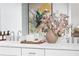 Close-up of bathroom vanity with double sinks, white countertop, and decorative accents at 2453 Red Maple Se Xing # 118, Smyrna, GA 30080