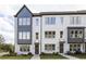 Charming townhome exterior with modern design and manicured front lawn and welcoming front door at 2453 Red Maple Se Xing # 118, Smyrna, GA 30080