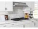 Modern kitchen design showcasing white cabinets, quartz countertops, and stainless steel range at 2453 Red Maple Se Xing # 118, Smyrna, GA 30080