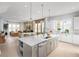 Open concept living area with open flow from kitchen, dining to living room at 2453 Red Maple Se Xing # 118, Smyrna, GA 30080