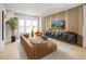 Cozy living room featuring stylish furniture, a wall-mounted TV, and large windows for natural light at 2453 Red Maple Se Xing # 118, Smyrna, GA 30080