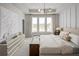 Spacious bedroom features large windows, tray ceiling, modern chandelier, and stylish furnishings at 2453 Red Maple Se Xing # 118, Smyrna, GA 30080