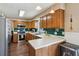 Well-equipped kitchen with stainless steel appliances, white countertops, and oak cabinetry at 2989 Abbotts Oak Way, Duluth, GA 30097