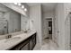 Modern bathroom boasts double sinks, a marble-look countertop, and a walk-in shower at 811 Pineberry Ct, Grayson, GA 30017