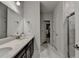 Stylish bathroom features double sinks, elegant marble countertops, and a walk-in shower at 811 Pineberry Ct, Grayson, GA 30017