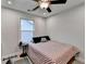 Bedroom features a bed, window, and neutral wall paint at 811 Pineberry Ct, Grayson, GA 30017