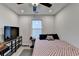 Bedroom features a bed, natural light, and a mounted tv at 811 Pineberry Ct, Grayson, GA 30017