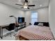 Comfortable bedroom with a work station, cozy bed, and natural light at 811 Pineberry Ct, Grayson, GA 30017