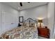 Inviting bedroom featuring a ceiling fan and a comfortable decorative bed with a view of the closet at 811 Pineberry Ct, Grayson, GA 30017