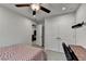 Bedroom featuring large double doors and a ceiling fan at 811 Pineberry Ct, Grayson, GA 30017