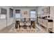 Elegant dining room featuring a wooden table, stylish chairs, and modern window coverings at 811 Pineberry Ct, Grayson, GA 30017