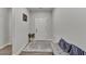 Inviting entryway with neutral walls, stylish rug, and bench seating at 811 Pineberry Ct, Grayson, GA 30017