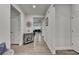 Bright hallway featuring hardwood floors and decorative accents, leading to the living spaces at 811 Pineberry Ct, Grayson, GA 30017