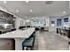 Open-concept kitchen and living area with large island, modern appliances, and hardwood flooring at 811 Pineberry Ct, Grayson, GA 30017