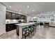 Open-concept kitchen and living area with large island, modern appliances, and hardwood flooring at 811 Pineberry Ct, Grayson, GA 30017