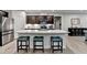 Kitchen featuring an island with seating and stainless steel appliances at 811 Pineberry Ct, Grayson, GA 30017