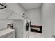 A well-lit laundry room with a washer, dryer, and functional storage solutions at 811 Pineberry Ct, Grayson, GA 30017