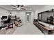 Cozy living room featuring a ceiling fan, entertainment center, and stylish decor at 811 Pineberry Ct, Grayson, GA 30017