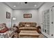Comfortable living room boasts stylish decor, hardwood floors, and plenty of natural light at 811 Pineberry Ct, Grayson, GA 30017