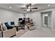 Bright living room with ceiling fan, plush seating, and neutral color palette at 811 Pineberry Ct, Grayson, GA 30017