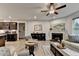 Comfortable and bright living room with a fireplace, open to the kitchen and dining area at 811 Pineberry Ct, Grayson, GA 30017