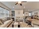 Open living space featuring large windows, comfortable furniture and view to the dining area at 811 Pineberry Ct, Grayson, GA 30017