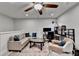 Inviting living room with ceiling fan, comfortable sofa, and decorative rug at 811 Pineberry Ct, Grayson, GA 30017