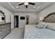 Well-lit main bedroom features a tray ceiling, soft carpet, and neutral decor at 811 Pineberry Ct, Grayson, GA 30017