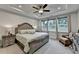 Serene main bedroom features a tray ceiling, plush carpet, and ample natural light at 811 Pineberry Ct, Grayson, GA 30017