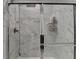 Close-up of a tiled shower with a rainfall showerhead and glass enclosure at 811 Pineberry Ct, Grayson, GA 30017