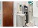 Bathroom features white vanity, matching mirror, and shower stall with glass door at 989 Queen Elizabeth Way, Morrow, GA 30260