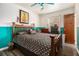 Bedroom featuring two-tone paint, hardwood flooring, and traditional wood door and trim at 989 Queen Elizabeth Way, Morrow, GA 30260