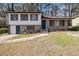 Charming two-story home featuring a brick facade and well-manicured lawn at 989 Queen Elizabeth Way, Morrow, GA 30260