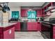 Compact kitchen featuring modern appliances and colorful cabinetry at 989 Queen Elizabeth Way, Morrow, GA 30260