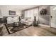 Inviting living room featuring hardwood floors, and an abundance of natural light at 989 Queen Elizabeth Way, Morrow, GA 30260