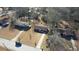 Aerial view showcasing property among neighboring homes with mature trees in the neighborhood at 11 Grove Ln, Hampton, GA 30228