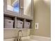 Bathroom featuring gray vanity, white countertop and white baskets for storage at 11 Grove Ln, Hampton, GA 30228