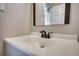 Bathroom featuring a vanity with a white countertop, a sink, and a mirror at 11 Grove Ln, Hampton, GA 30228