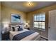 Cozy bedroom featuring natural light, stylish furnishings, and calming decor for relaxation at 11 Grove Ln, Hampton, GA 30228