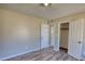 Spacious bedroom with carpet flooring, a window, and a closet at 11 Grove Ln, Hampton, GA 30228